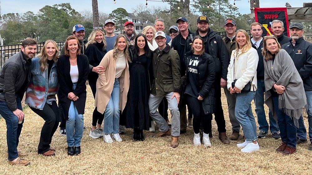 alumni posing outside for a picture