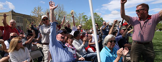 Alumni cheering at a reunion