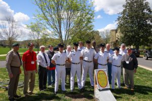 cadets and alumni pose in front of Unity Tree