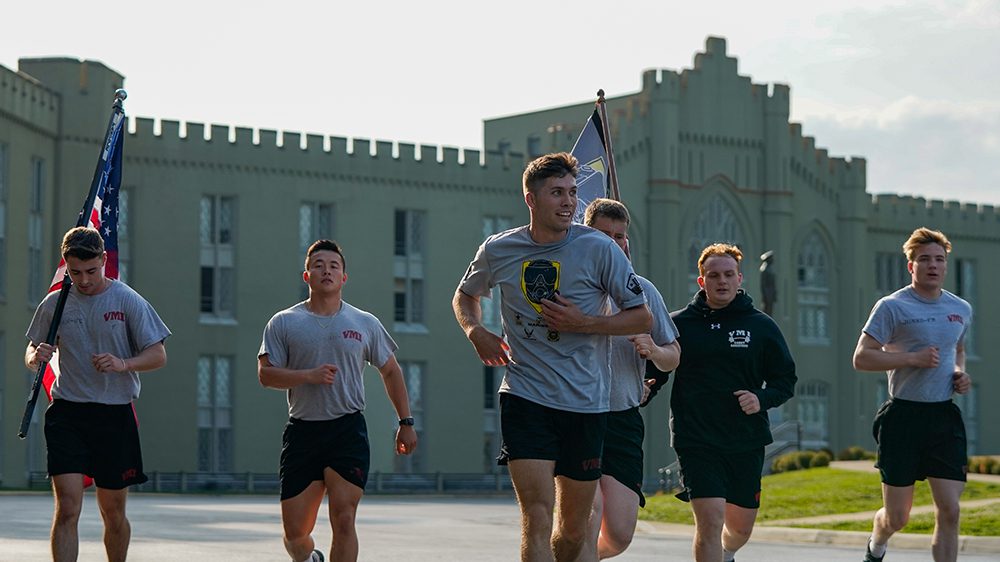 cadets running in front of barracks