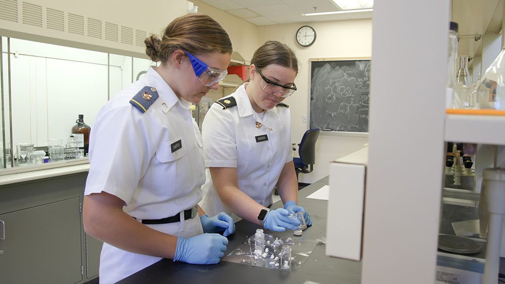 Emma Cameron '25 and Shannon Quevedo, Ph.D. in chemistry lab