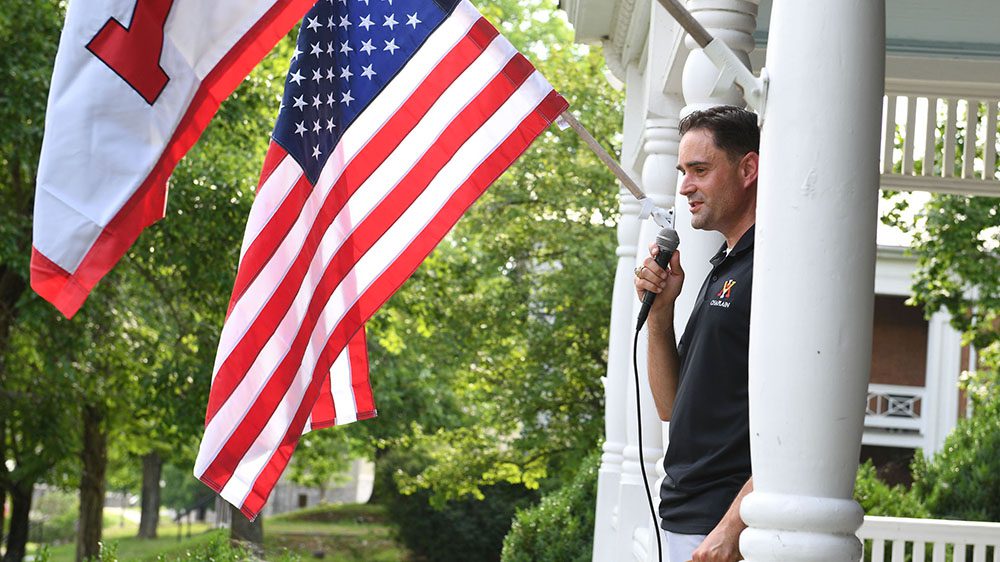 Lt. Col. John P. Casper ’04 speaking into microphone