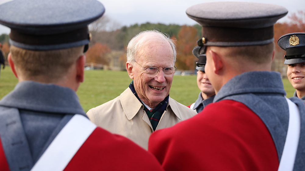 Conrad M. Hall smiling and talking with cadets