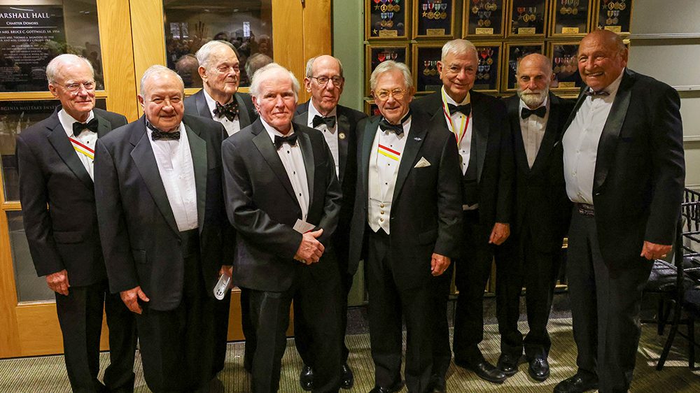 group of gentlemen in tuxedos smiling