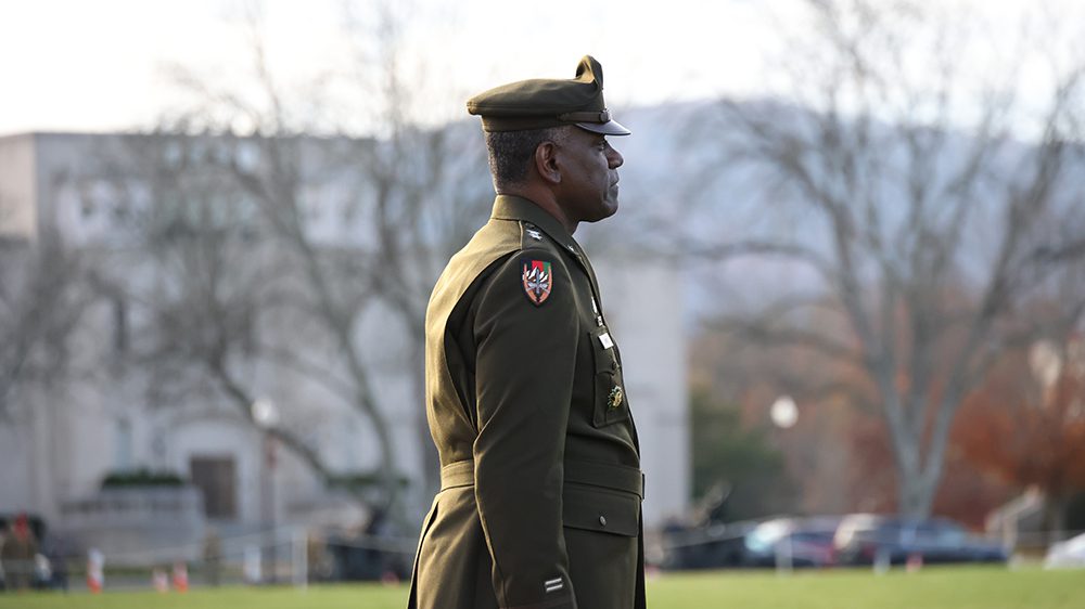 Maj. Gen. Cedric Wins '85, superintendent, looking out onto parade field.