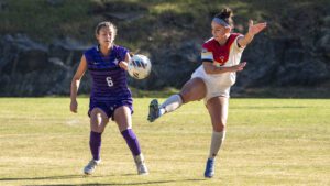 VMI women's soccer player Delilah Martindale '25 kicking a soccer ball