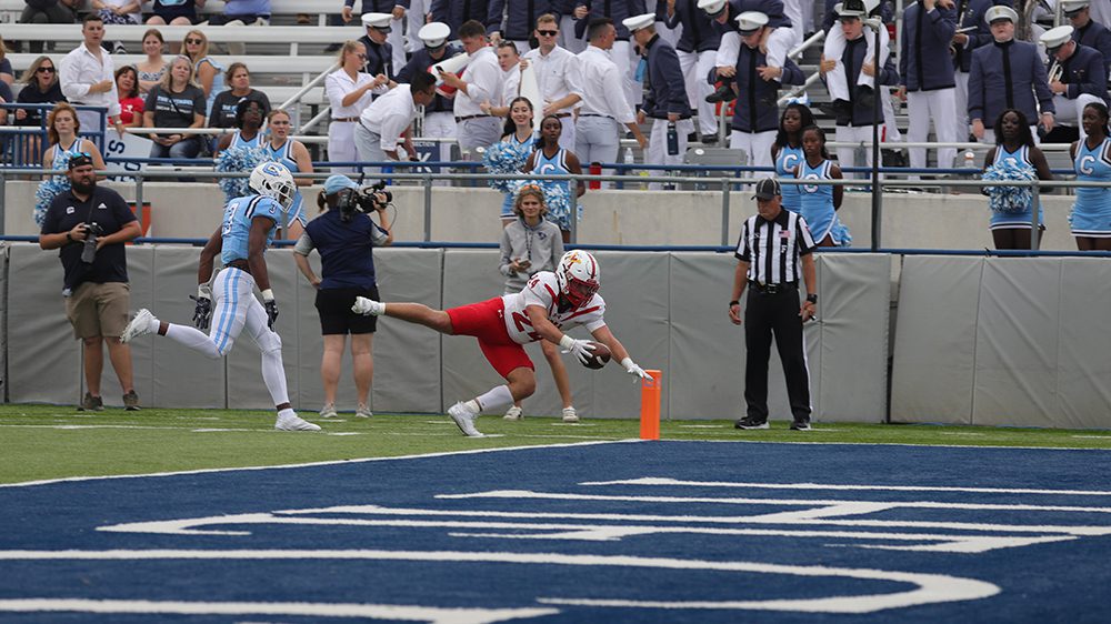 football player diving into endzone