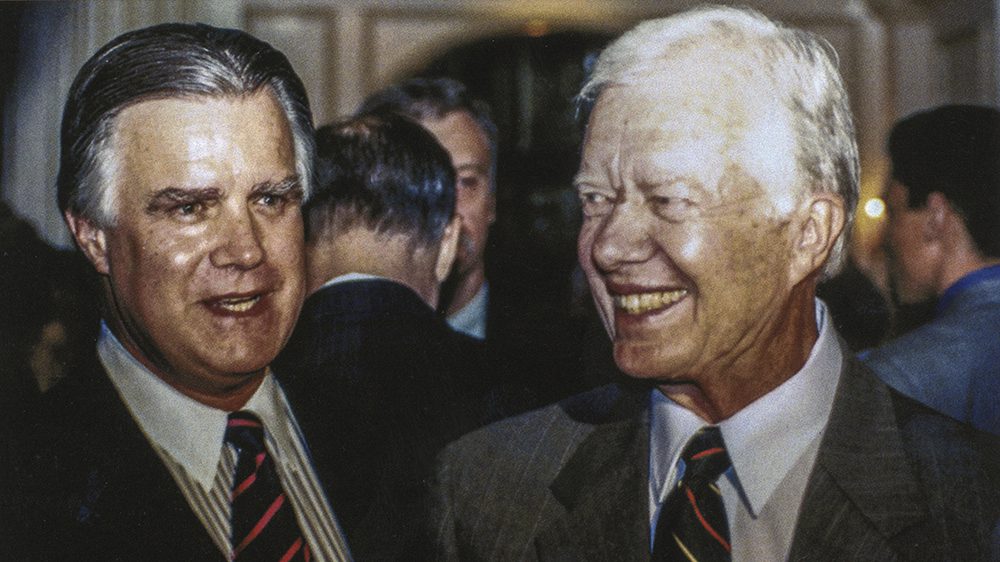John Duke Anthony ’62, Ph.D. (left) is pictured with former U.S. President Jimmy Carter