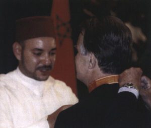 Moroccan King Muhammad VI (left) knights John Duke Anthony ’62, Ph.D.