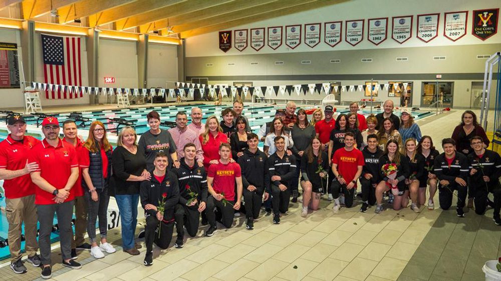 VMI swim and dive team gathered and smiling for photo