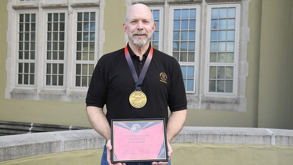 Col. Dan Barr ’74 displays his awards from the United States Powerlifting Coalition.