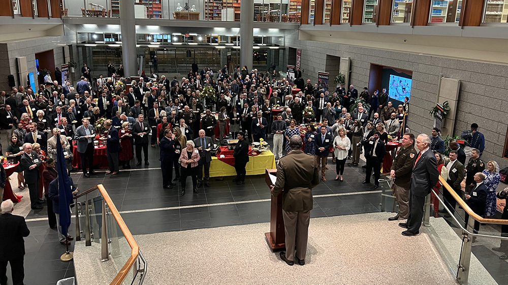 Maj. Gen. Cedric Wins '85, superintendent, addresses crowd of attendees from podium at Legislative Reception at the Library of Virginia.