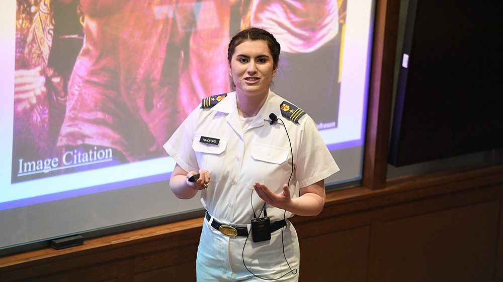 Cadet Gabriella Handford ’24 discusses her research in Scott Shipp Hall.