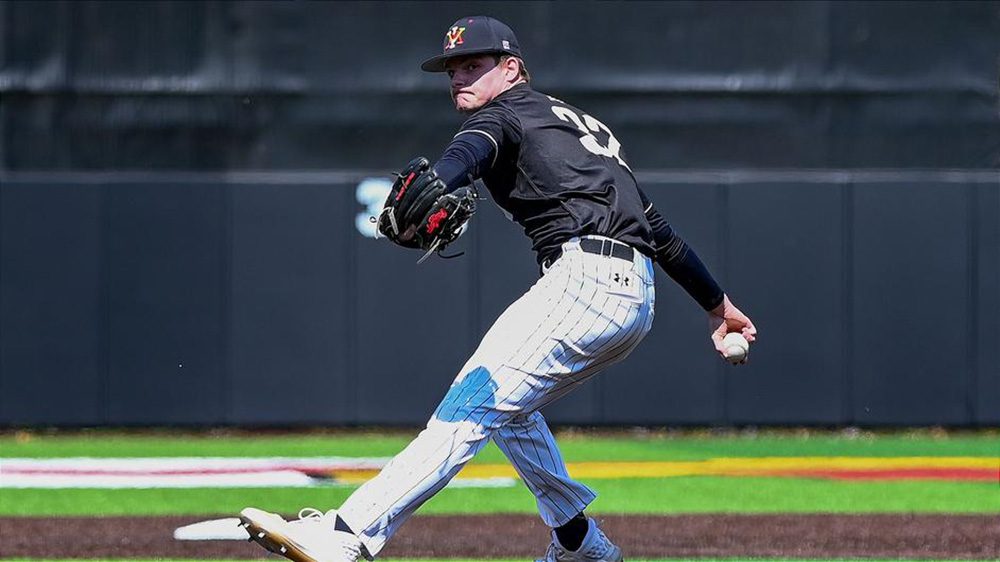 baseball player preparing to pitch ball