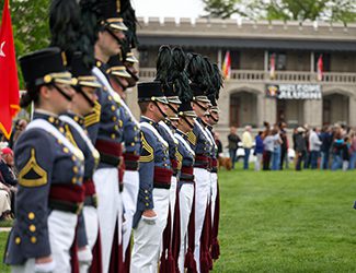 Cadets in parade with Moody Hall behind