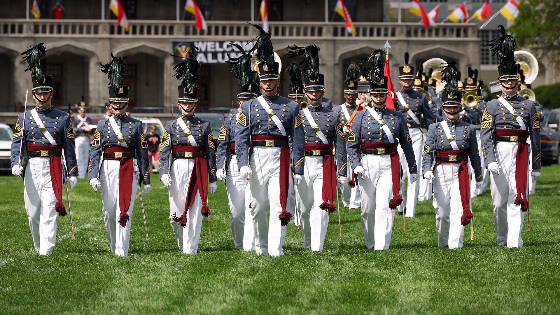 Cadets marching in parade with Moody Hall in the background