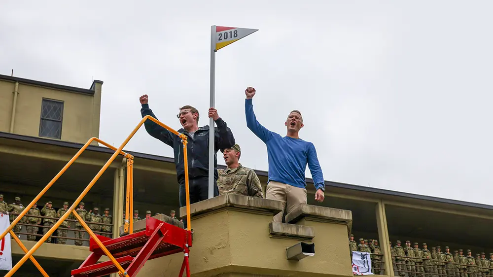 alumni on sentinel box giving an Old Yell