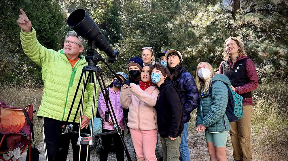 Tom Evans ’66 pointing out sights to park visitors
