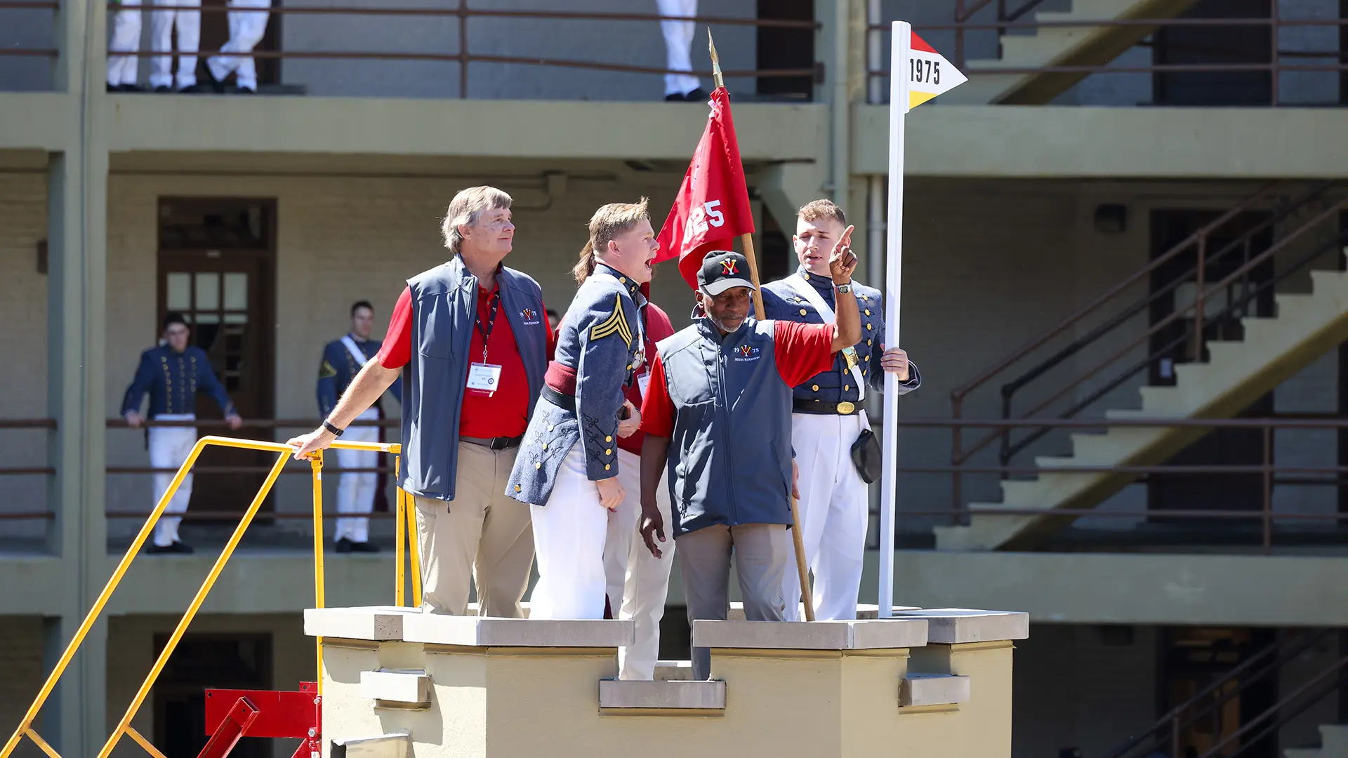 Alumni and cadets yelling at sentinel box