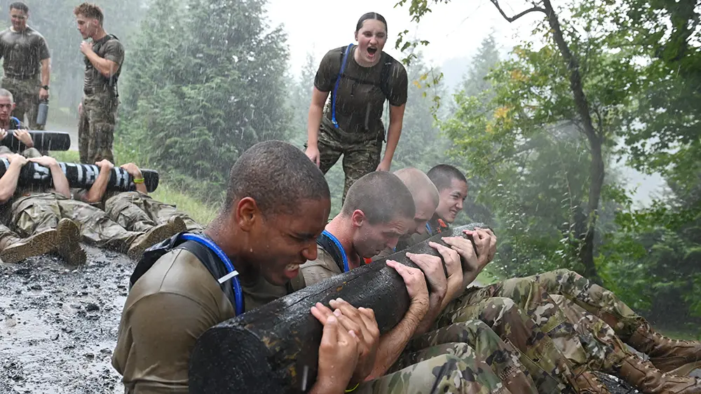 cadets doing curl-ups with log