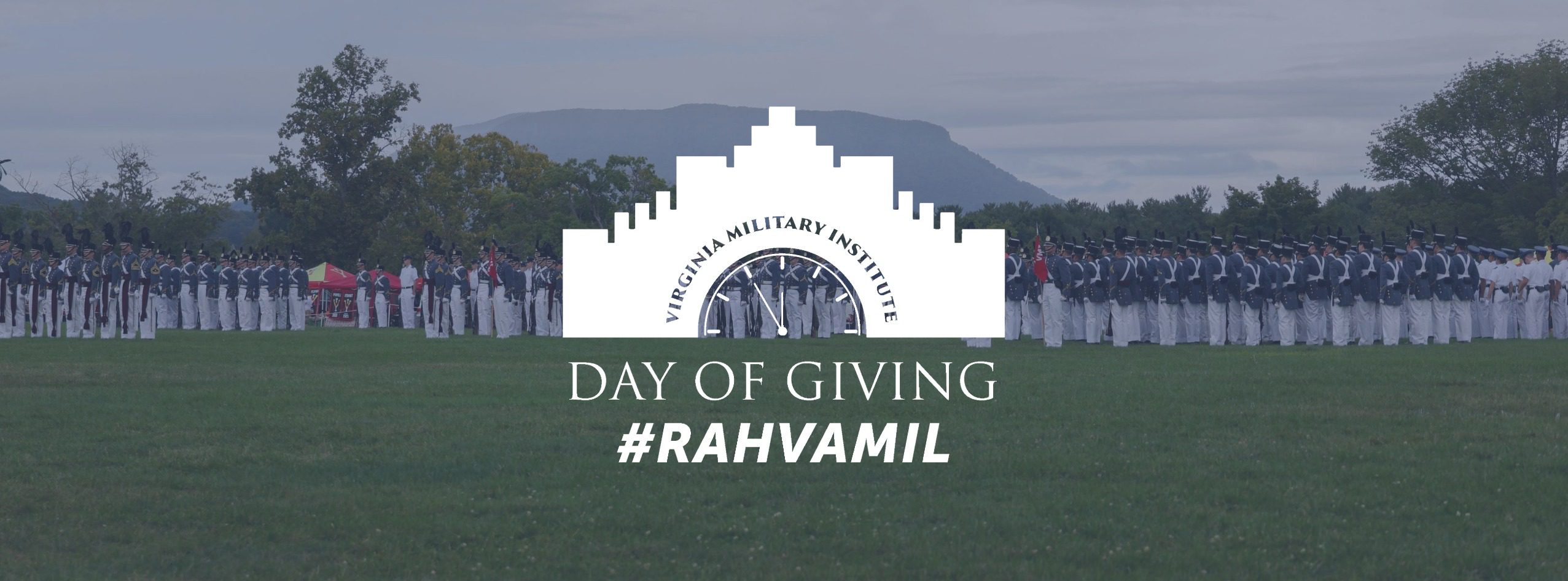 Day of Giving logo with faded picture of parade and House Mountain in background