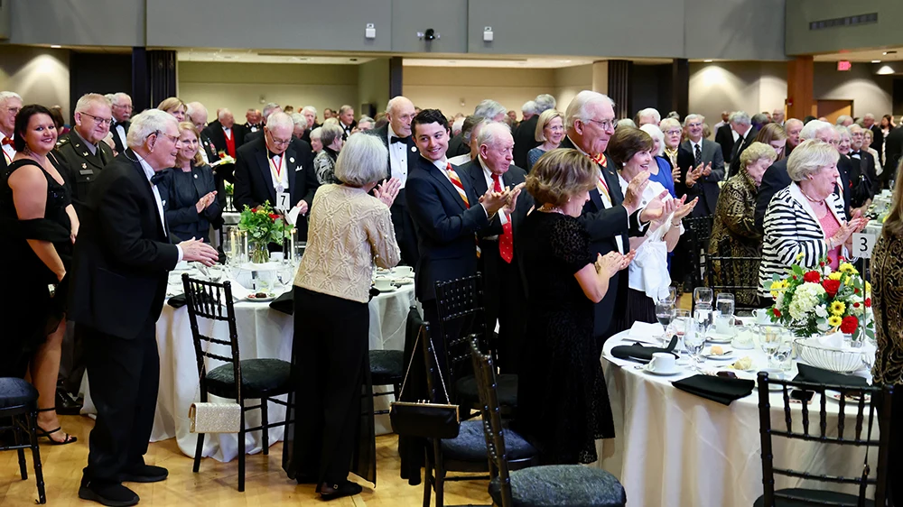 audience in Hall of Valor clapping and smiling