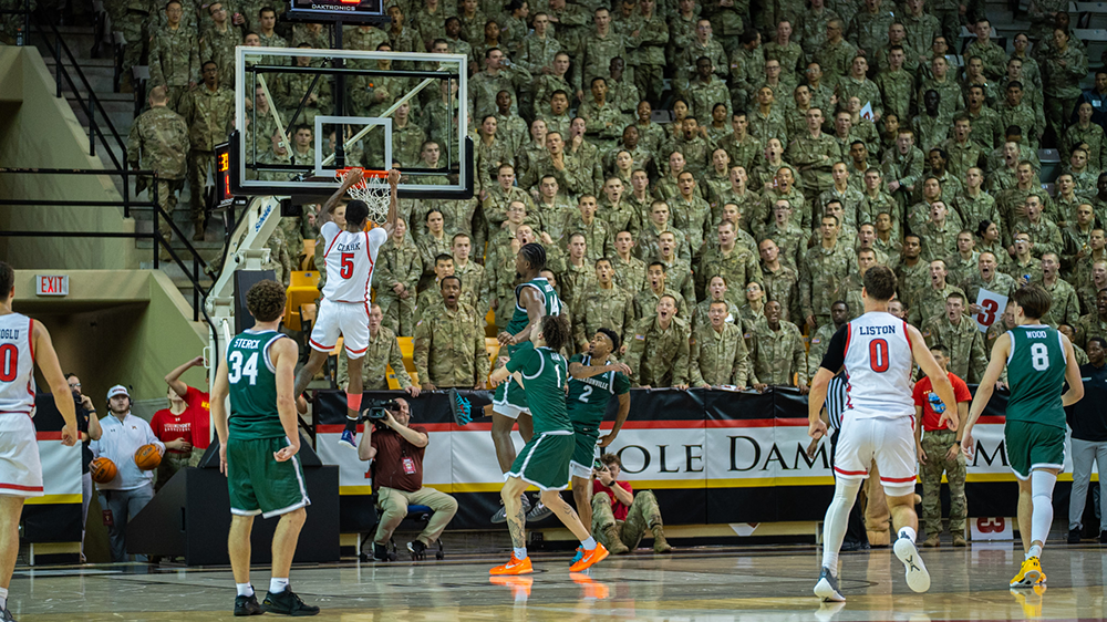 VMI basketball player dunking ball into hoop