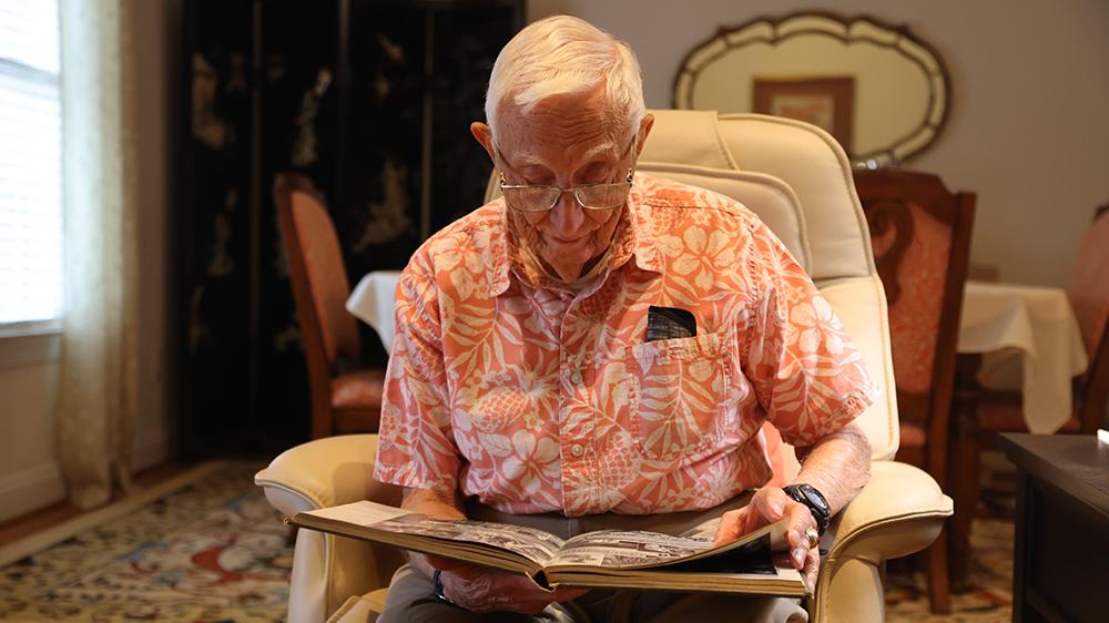 James “Ding” Patton ’49B looks through the 1949 Bomb