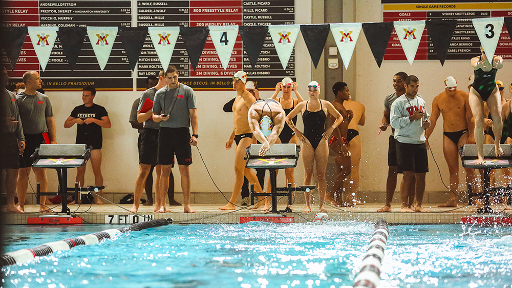 swimmer diving into pool